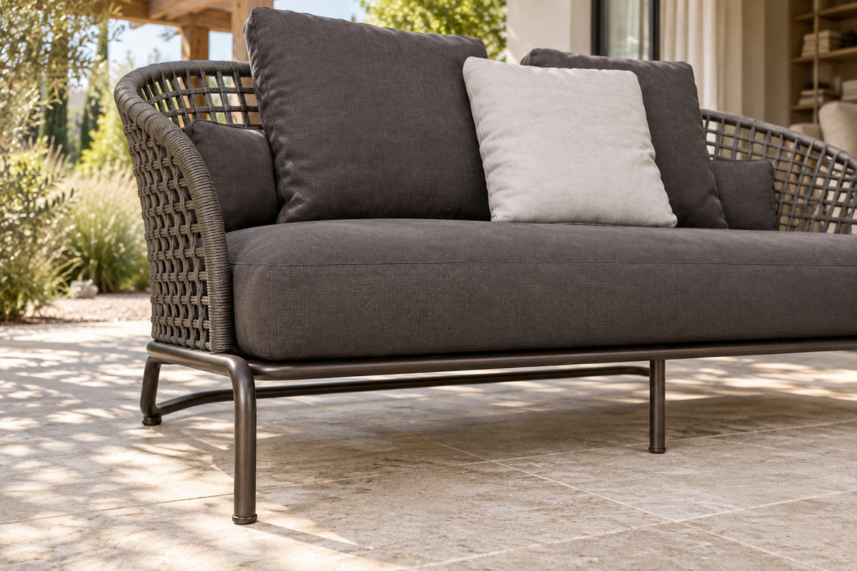 Ischia Two-Seat Sofa, low near-side-profile lifestyle view