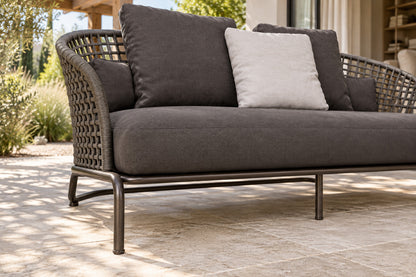 Ischia Two-Seat Sofa, low near-side-profile lifestyle view
