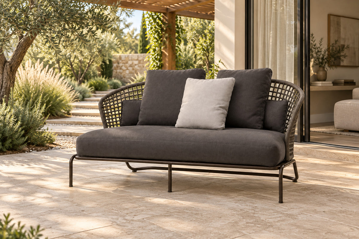 Ischia Two-Seat Sofa, front-right three-quarter lifestyle view