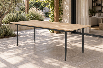 Naxos Dining Table, front-right three-quarter lifestyle view