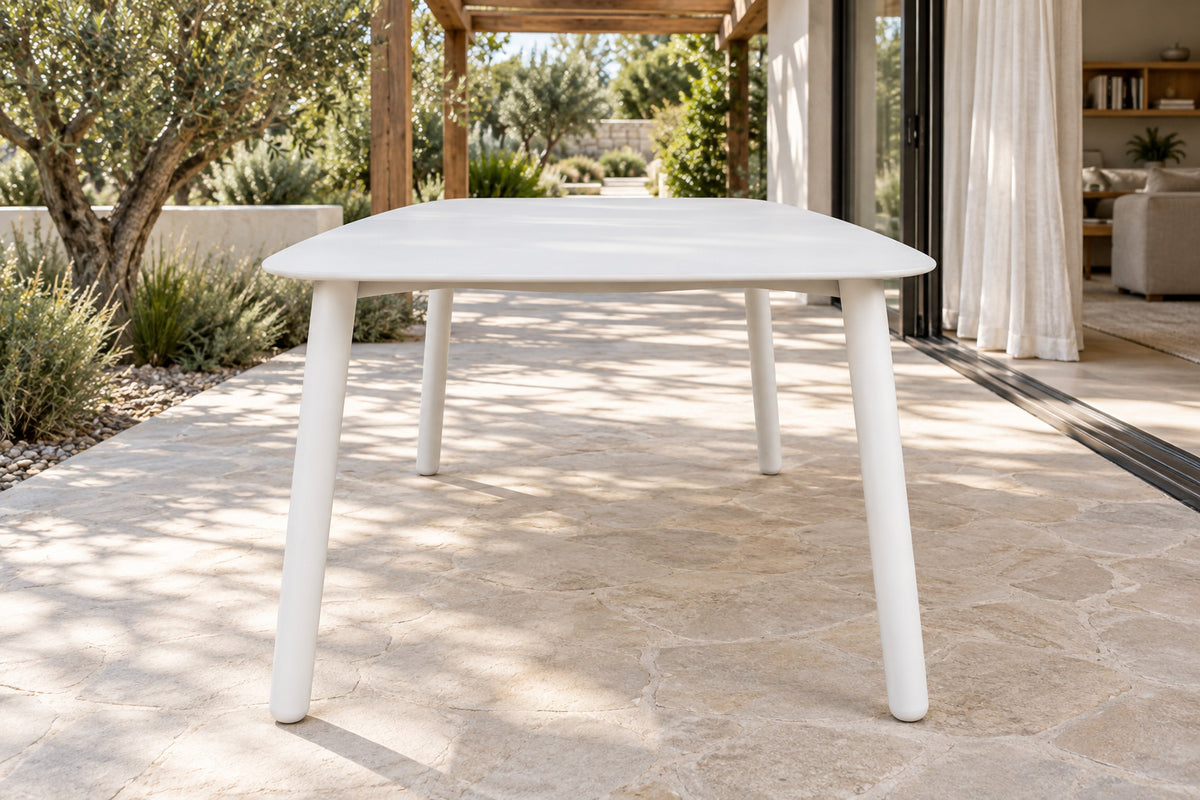 Paros Dining Table, low near-side-profile lifestyle view