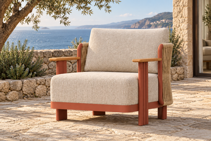 Lifestyle view: Aria aluminium lounge chair on a coastal stone terrace