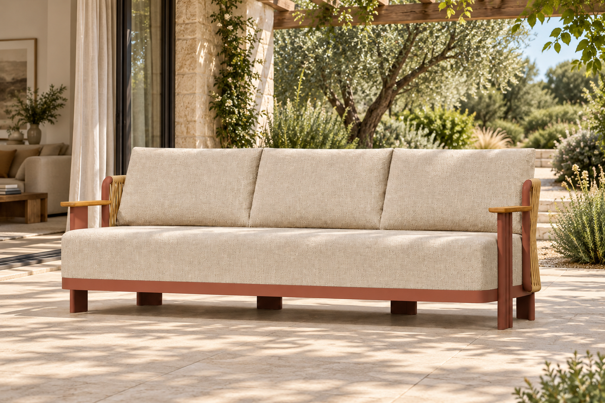Lifestyle view: Aria aluminium sofa on a planted garden terrace