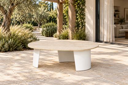 Lifestyle view: Luna aluminium coffee table beside a garden and furnished living room