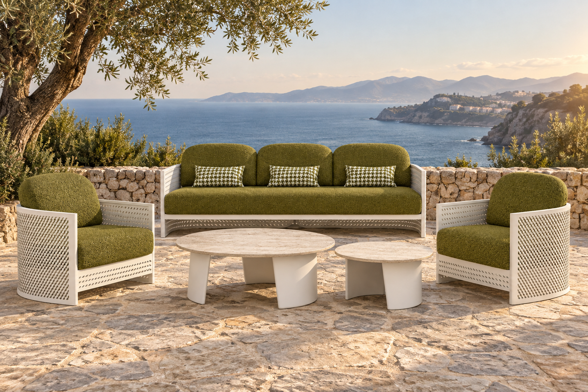 Lifestyle view: Luna aluminium sofa set with olive cushions, two lounge chairs and two travertine tables on a coastal terrace