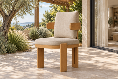 Lifestyle view: Serein teak dining chair beside a planted garden and furnished home