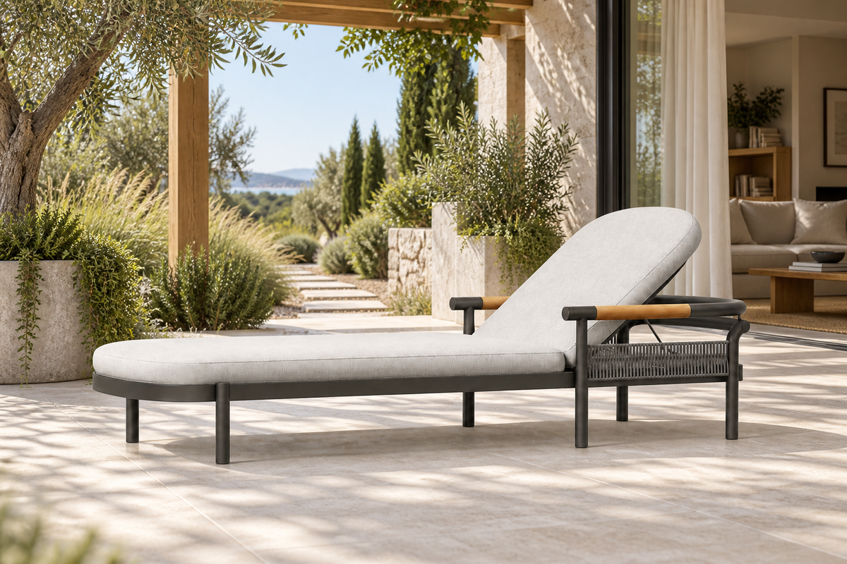 Lifestyle view: Zenia aluminium sun lounger beside a planted garden and furnished home
