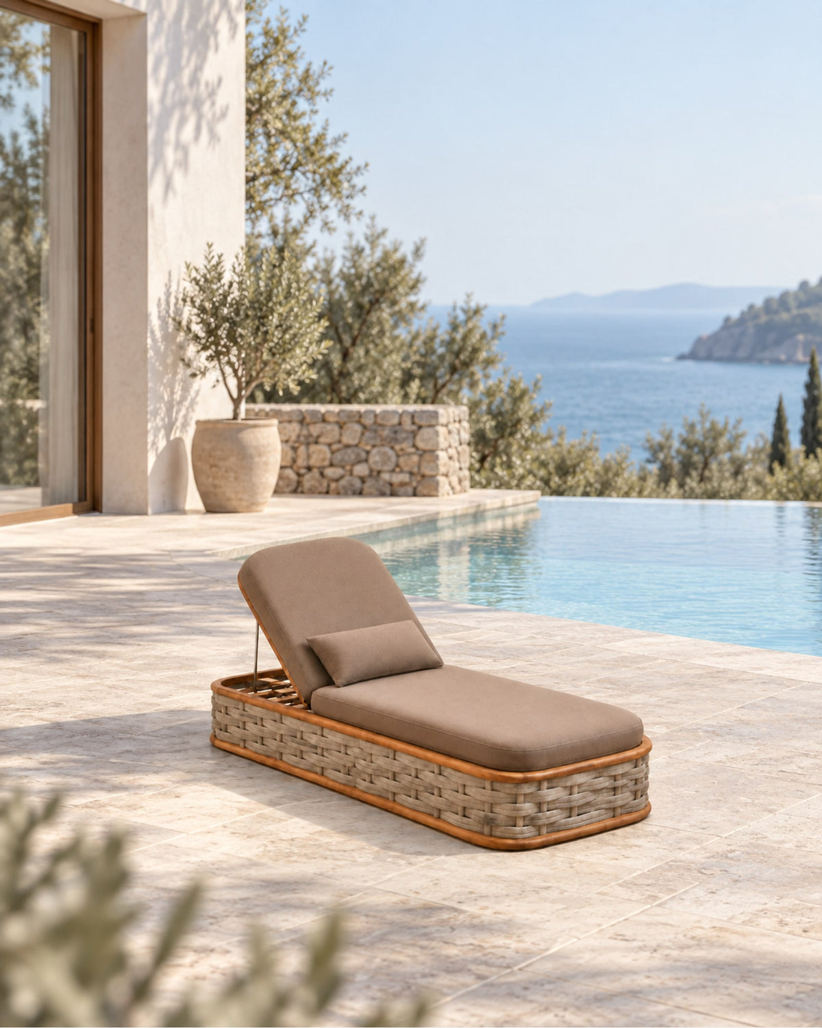Vela Woven Sun Lounger in Teak in a styled setting