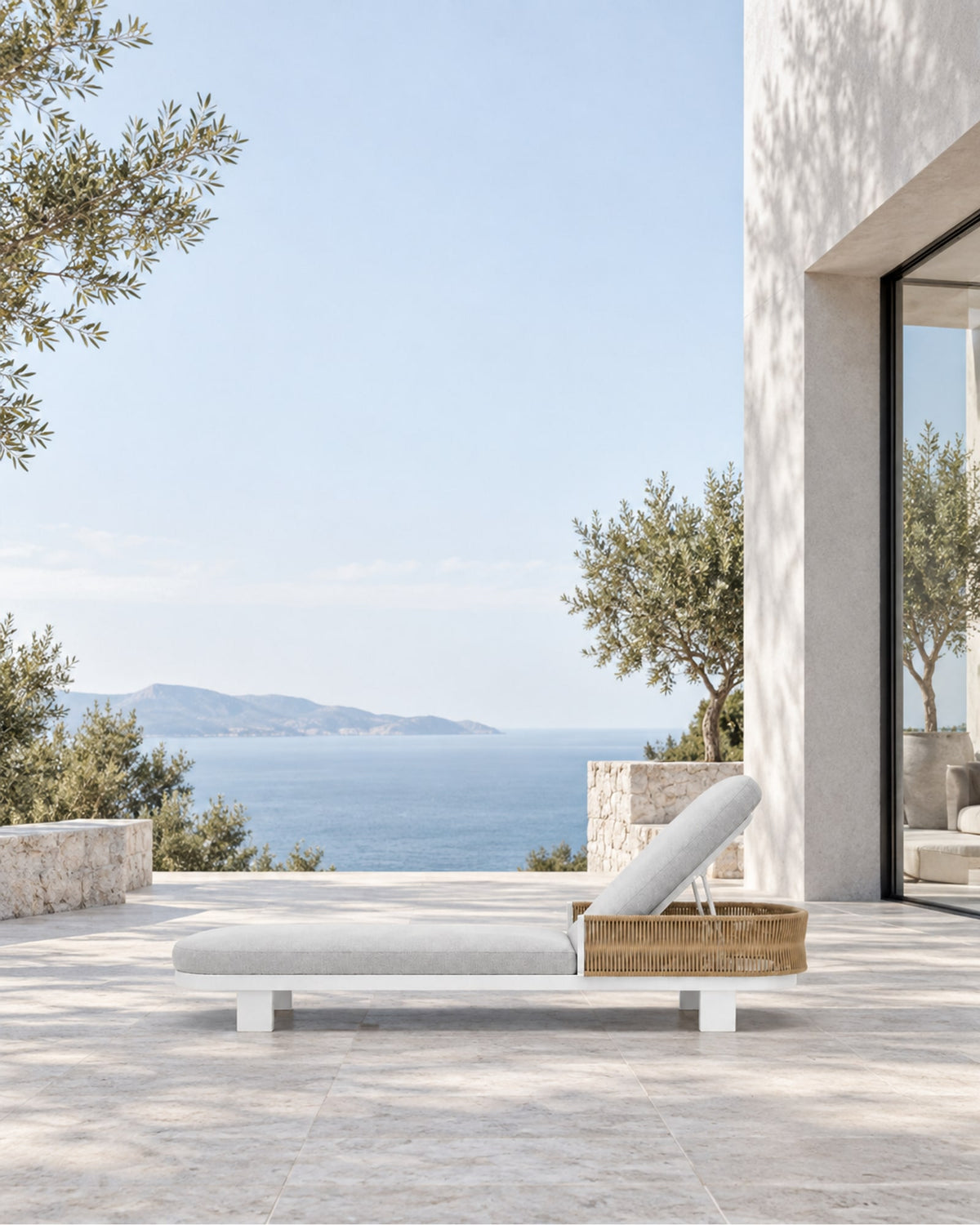 Ripple Reclining Sun Lounger in Aluminium in a styled setting