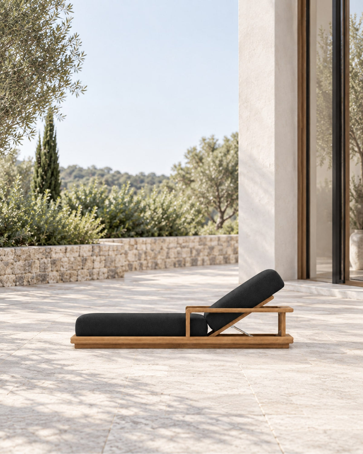 Grace Sun Lounger in Teak in a styled setting