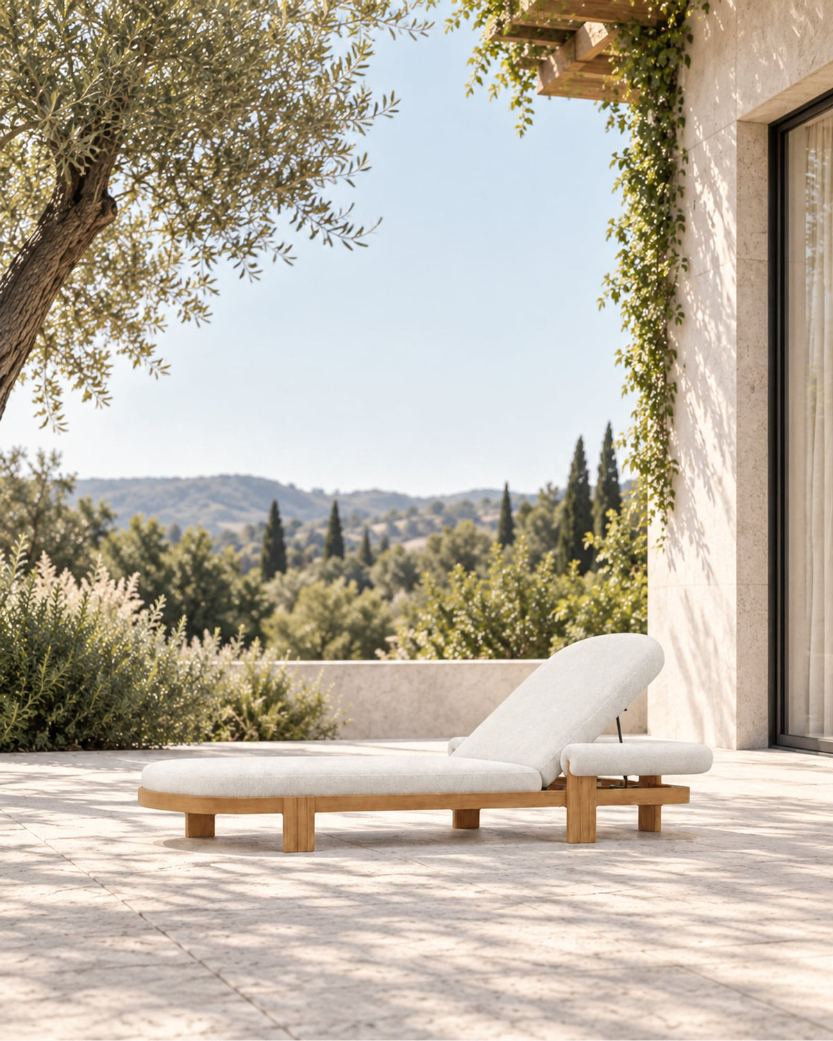 Ethereal Sun Lounger in Teak in a styled setting