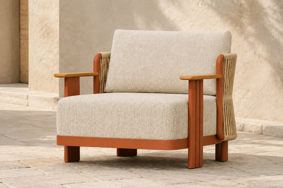 Aria Lounge Chair in Aluminium, photographed in a quiet outdoor courtyard