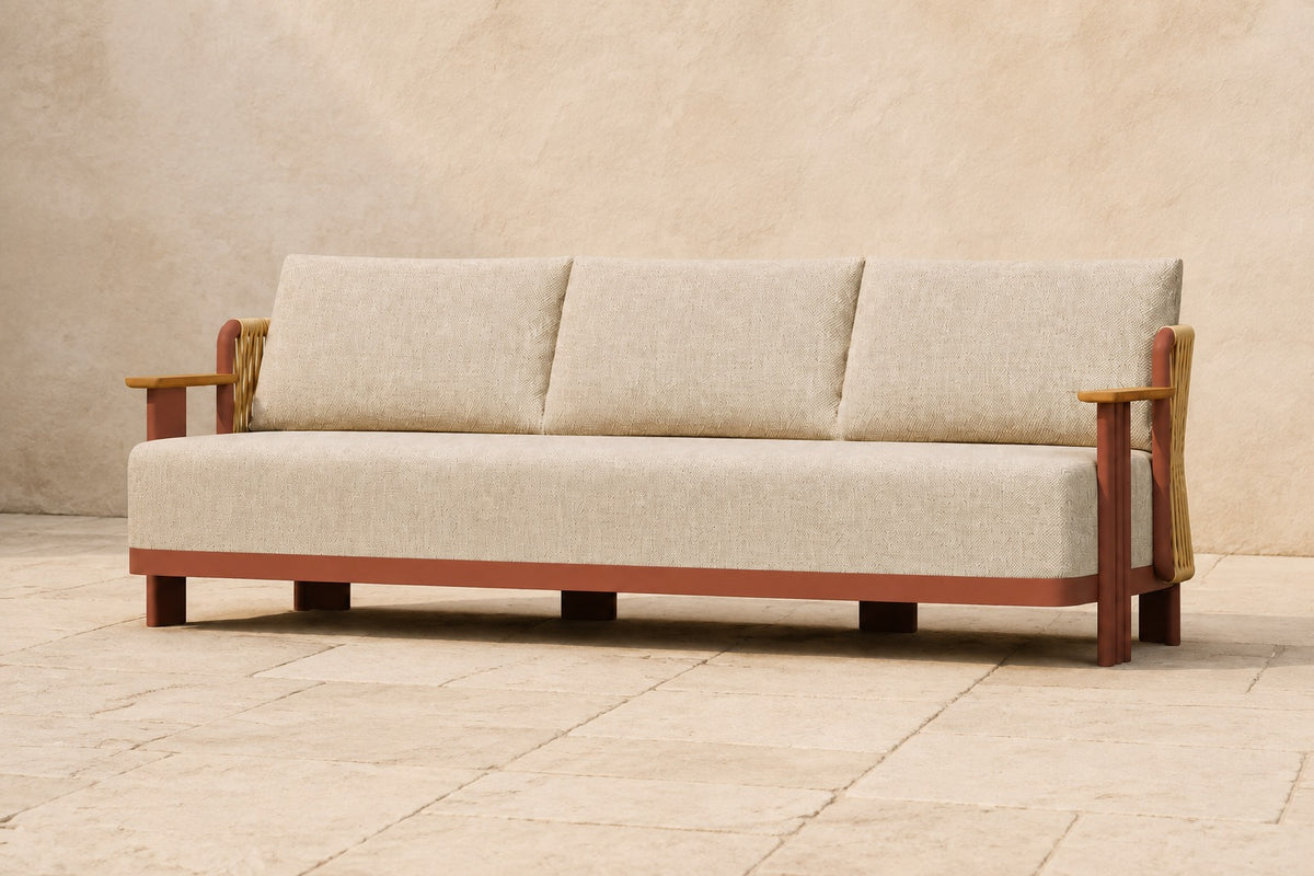 Aria Sofa in Aluminium, photographed in a quiet outdoor courtyard