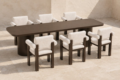 Ethereal Outdoor Dining Set in Aluminium, photographed in a quiet outdoor courtyard