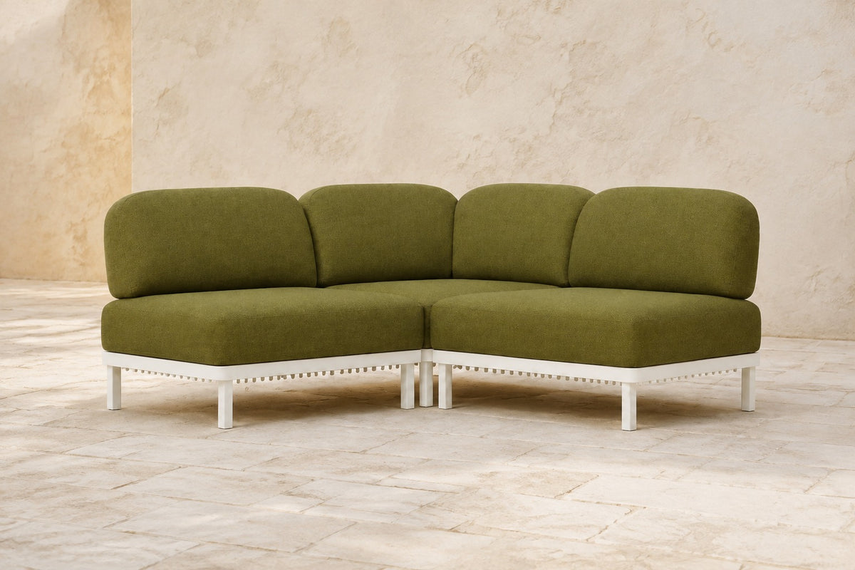 Luna Modular Corner Sofa in Aluminium, photographed in a quiet outdoor courtyard