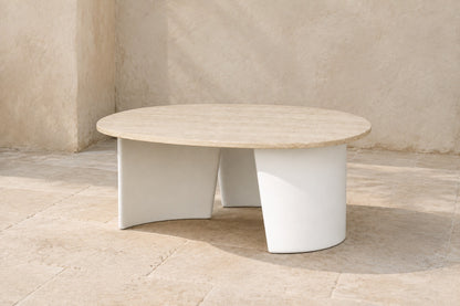 Luna Side Table in Aluminium, photographed in a quiet outdoor courtyard