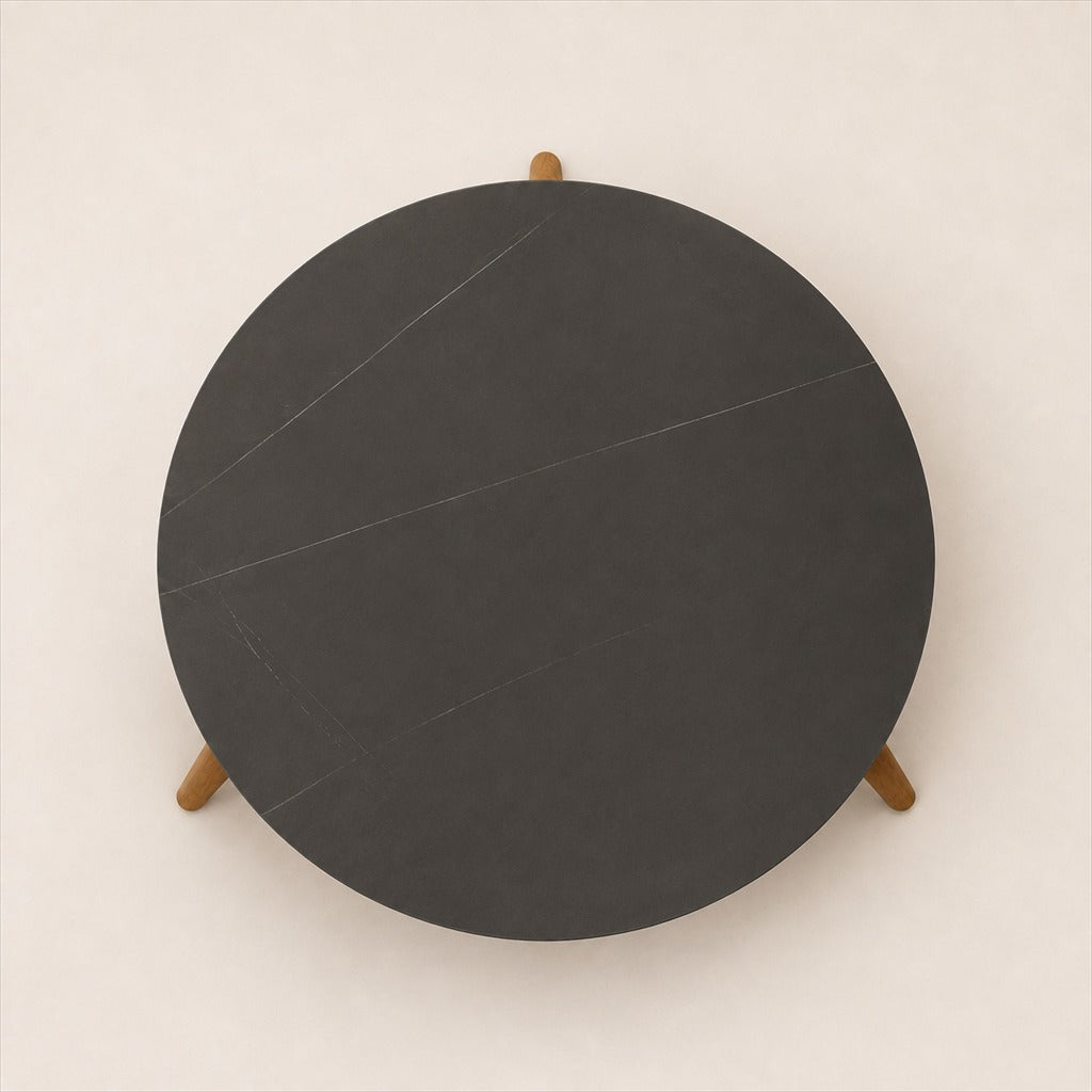 Marisol 70 cm coffee table with dark solid circular top and three timber legs, top view