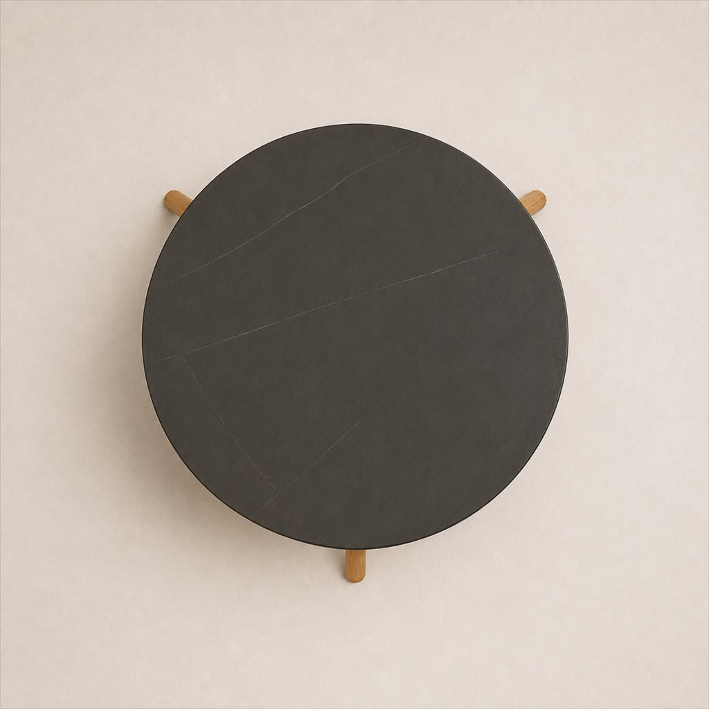 Marisol 90 cm coffee table with dark solid circular top and three timber legs, top view