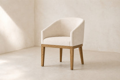 Morgan Barrelback Slope Arm Fabric Dining Armchair, photographed in a quiet dining room