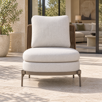 Lifestyle view: Amalfi Lounge Chair, Slipper, photographed in a quiet outdoor courtyard
