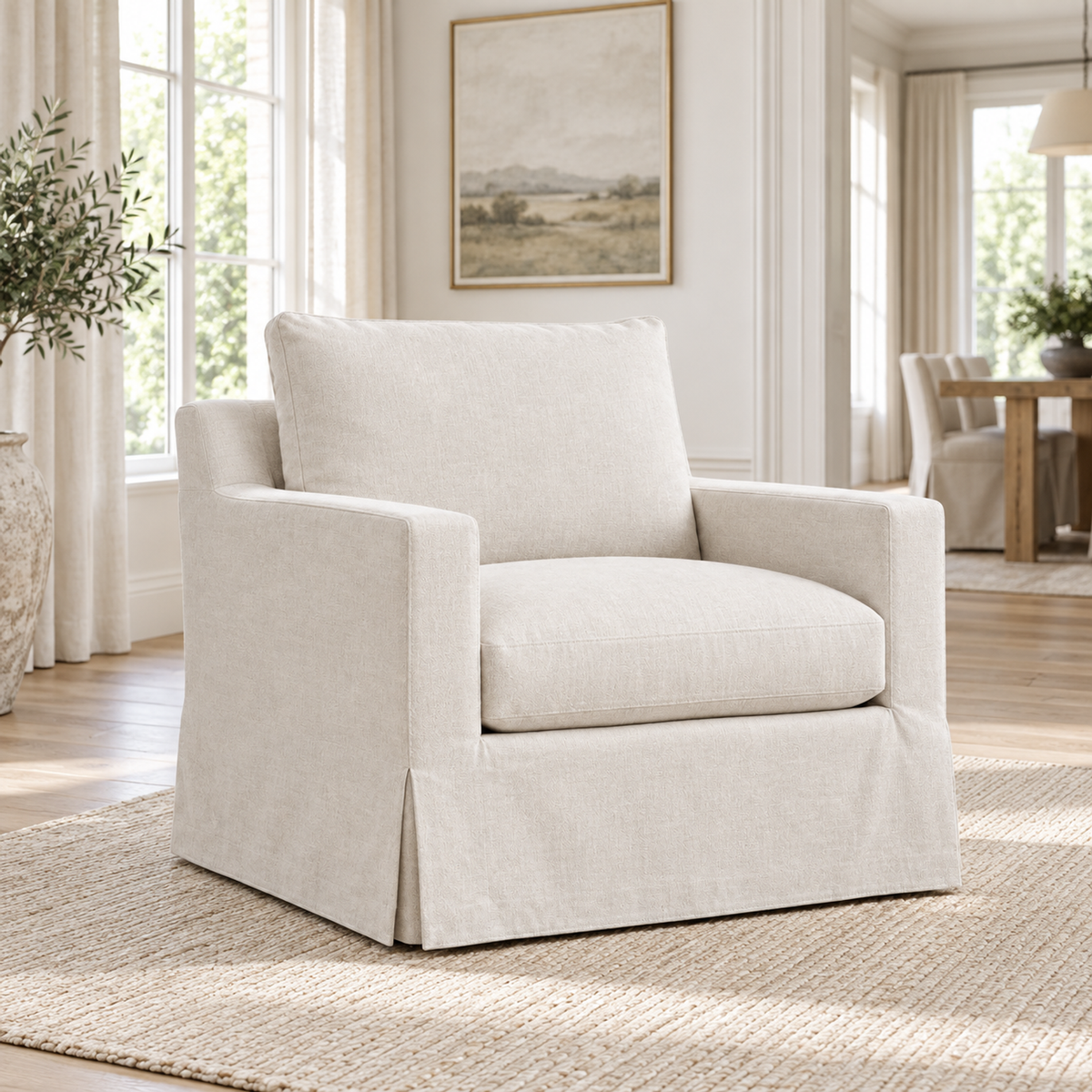 Lifestyle view: Belgian Slipcovered Track Arm Swivel Chair — photographed in a living room