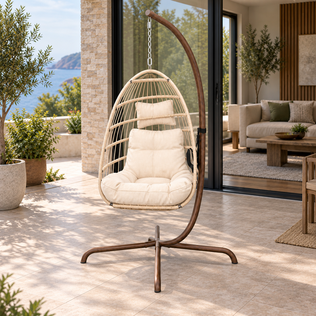 Lifestyle view: Corda Hanging Chair with Stand, photographed in a quiet outdoor courtyard
