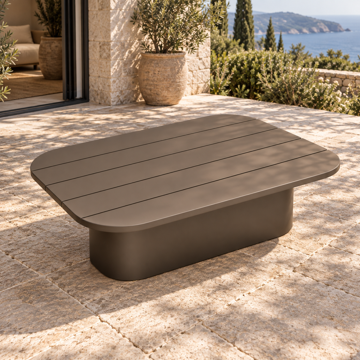 Lifestyle view: Ethereal Coffee Table in Aluminium, elevated opposite diagonal on a furnished home terrace