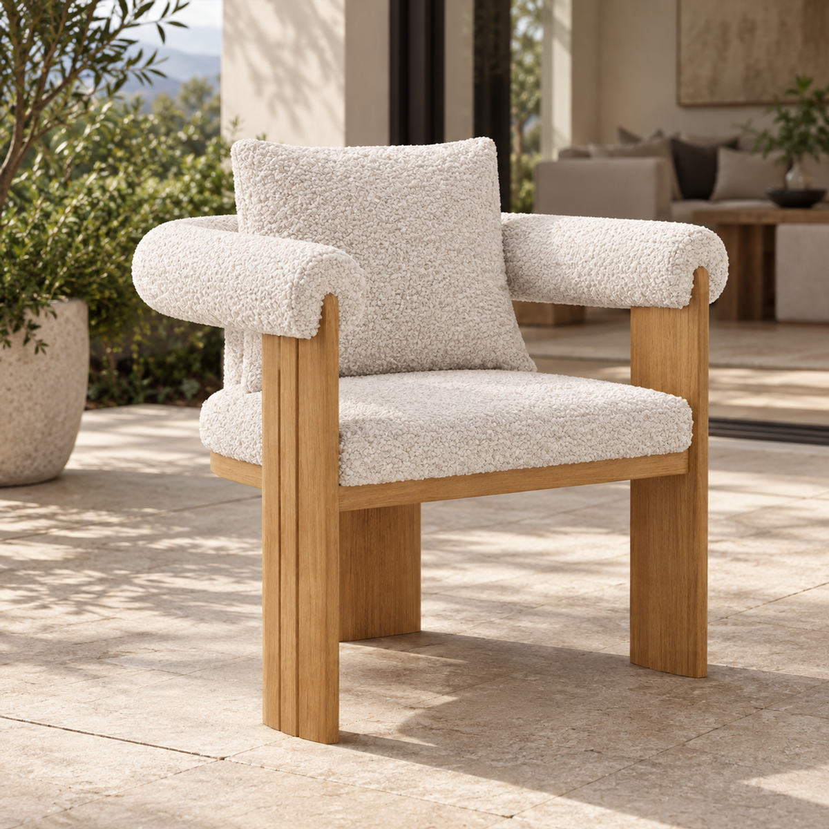 Lifestyle view: Ethereal teak dining chair, left diagonal view on a furnished home terrace