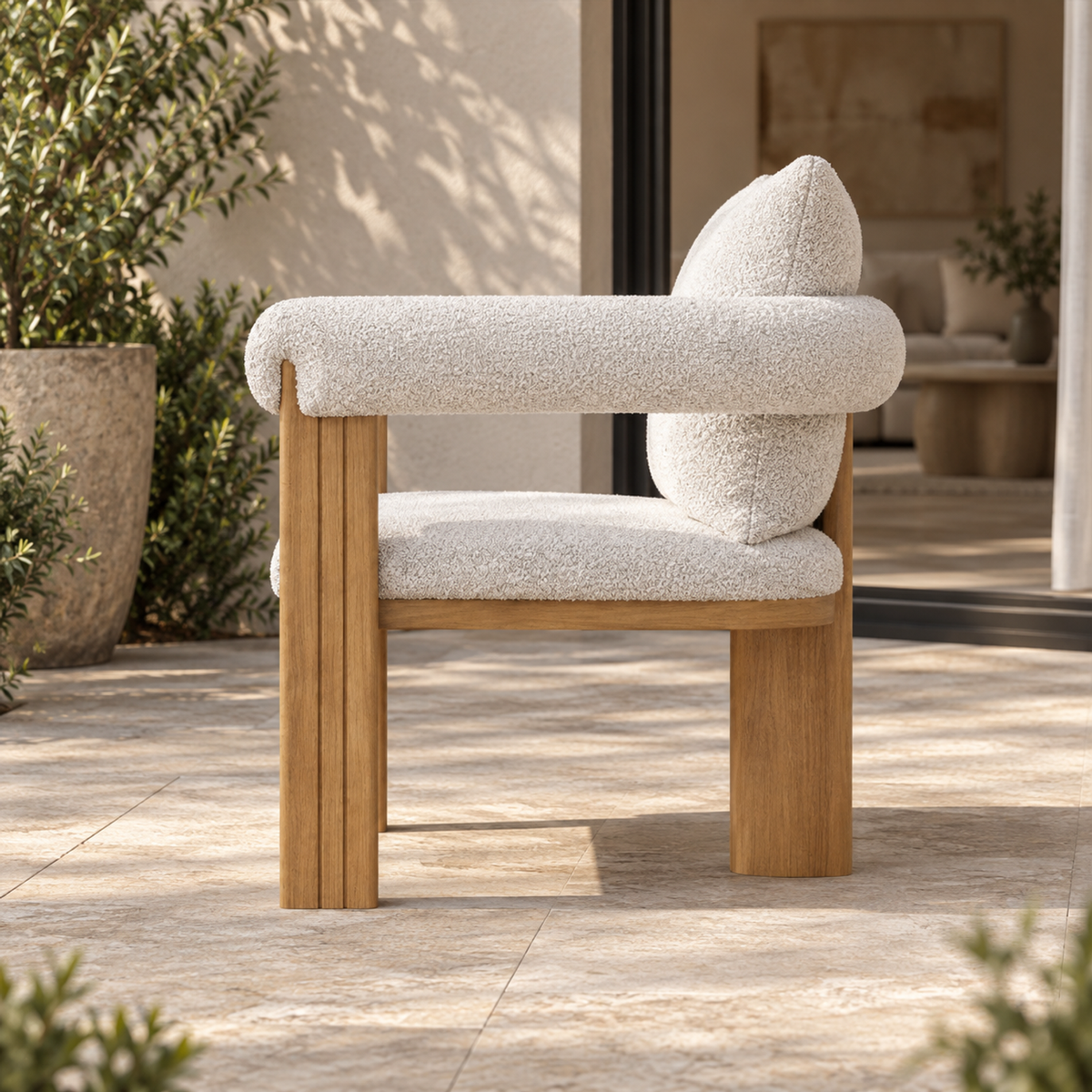 Ethereal teak dining chair, true side profile on a furnished terrace