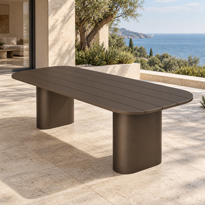 Lifestyle view: Ethereal Dining Table in Aluminium, opposite diagonal view on a coastal home terrace