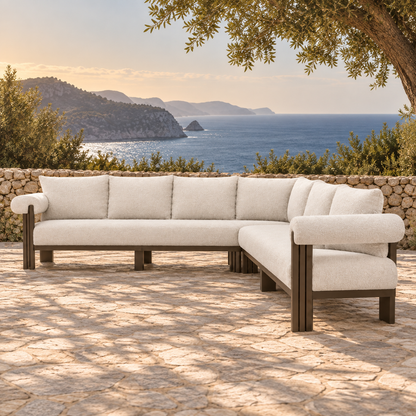 Lifestyle view: Ethereal L-Sectional in Aluminium, right-end three-quarter view on a coastal terrace