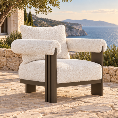 Lifestyle view: Ethereal Lounge Chair in Aluminium, opposite three-quarter view on a coastal home terrace
