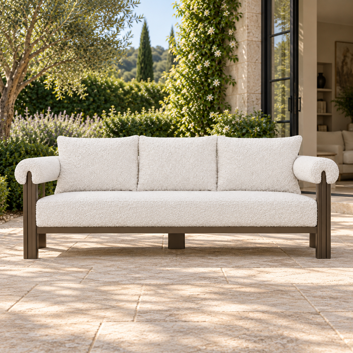 Lifestyle view: Ethereal Sofa in Aluminium, frontal view beside an open living room and planted courtyard