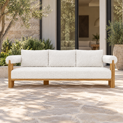 Lifestyle view: Ethereal Sofa in Teak, straight frontal view on a garden courtyard terrace