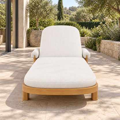 Lifestyle view: Ethereal Sun Lounger in Teak, centered view from the foot end in a home garden