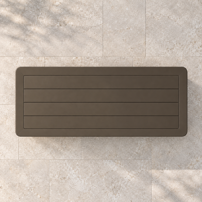 Grace aluminium coffee table, overhead view on a stone terrace