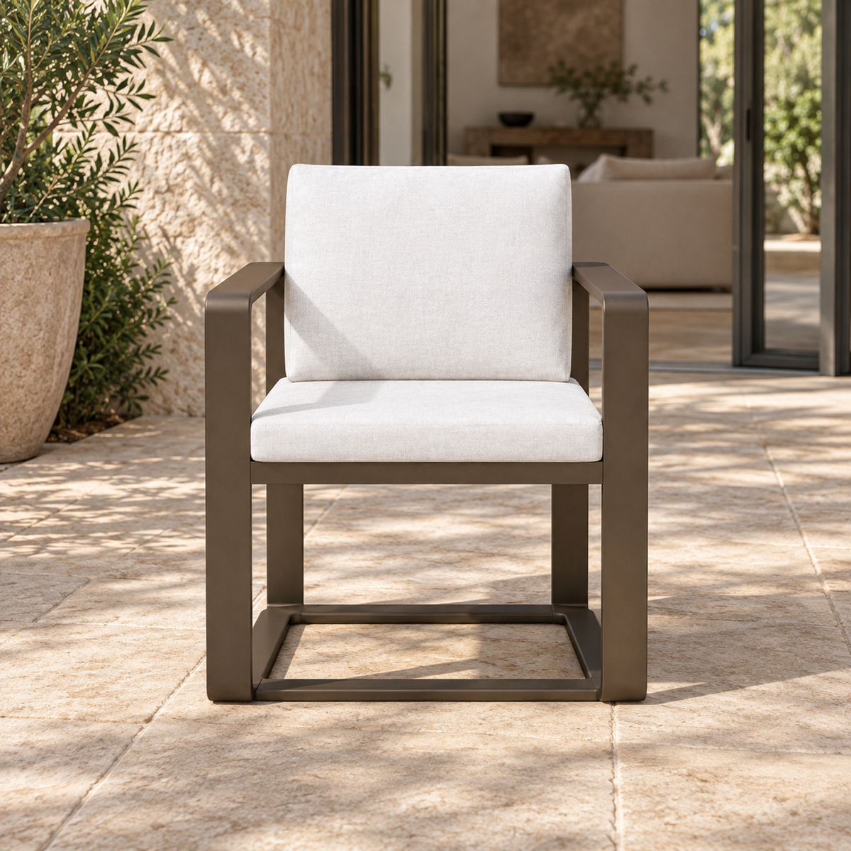 Grace aluminium dining chair, straight front view on a furnished home terrace