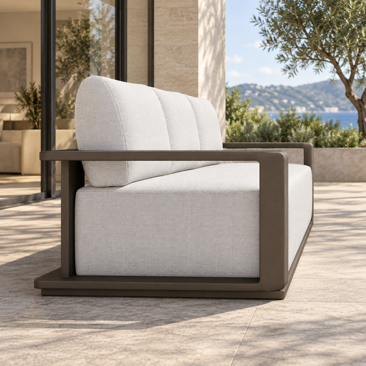 Grace aluminium sofa, left end view on a furnished home terrace