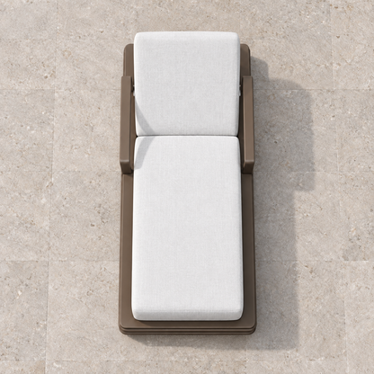 Grace aluminium sun lounger, overhead view on a stone terrace