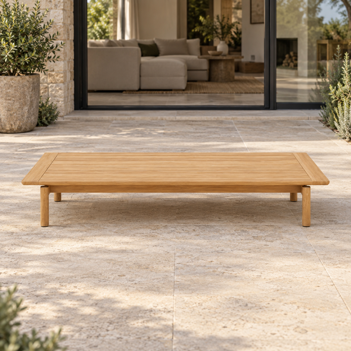 Lifestyle view: Ithaca Coffee Table, 160 cm, photographed in a quiet outdoor courtyard