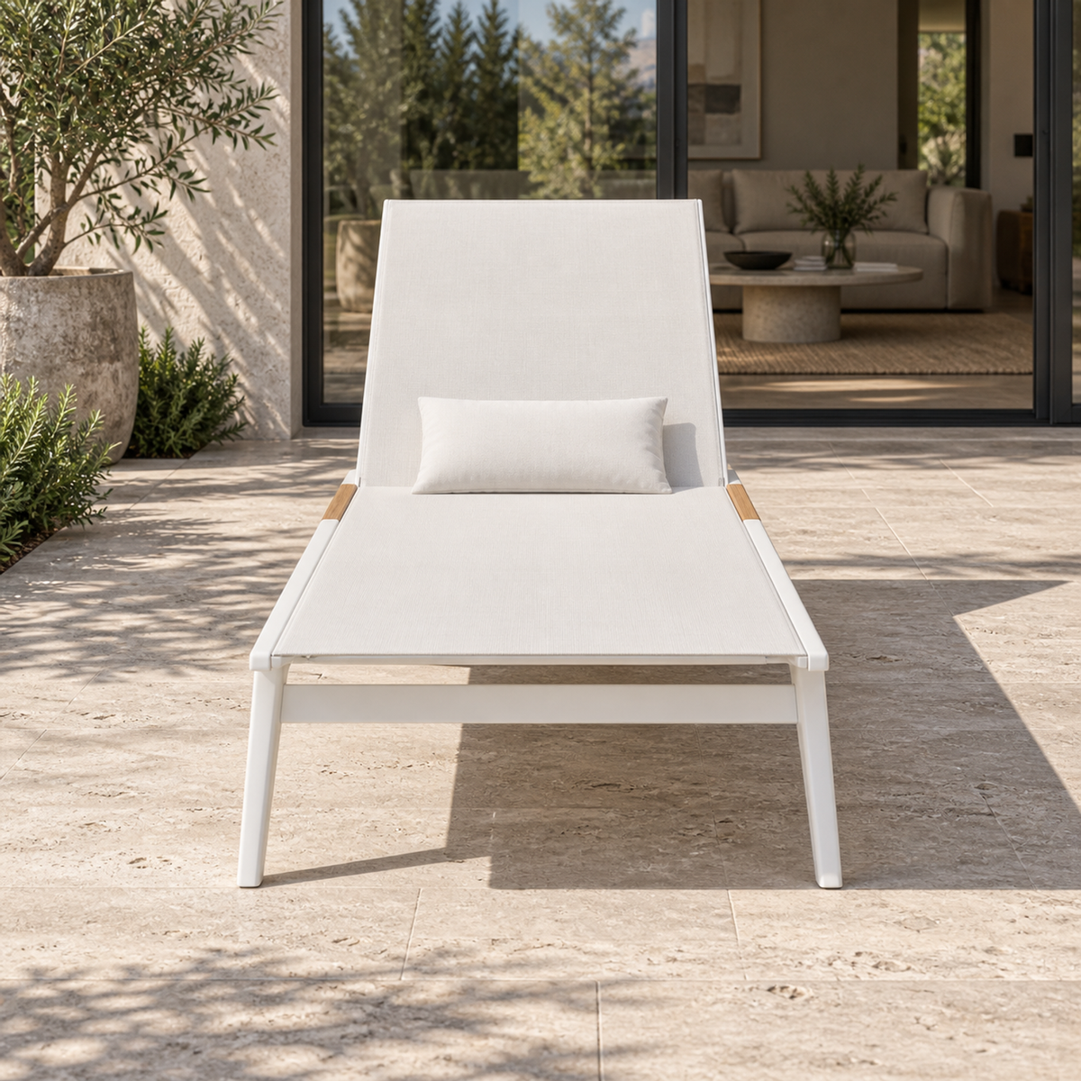 Lifestyle view: Lido Sun Lounger, photographed in a quiet outdoor courtyard
