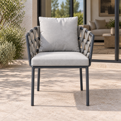 Lifestyle view: Naxos Dining Chair, photographed in a quiet outdoor courtyard