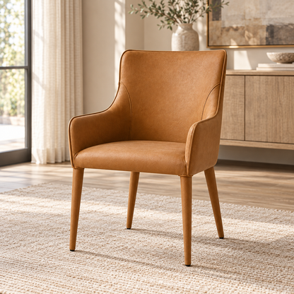 Lifestyle view: Nicola vegan leather dining armchair in a sunlit furnished dining room