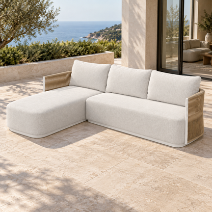 Lifestyle view: Ripple Chaise Sectional in Aluminium, right three-quarter view on a coastal home terrace