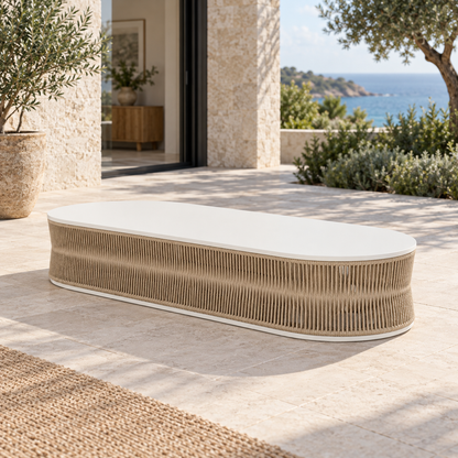 Lifestyle view: Ripple Coffee Table in Aluminium, elevated diagonal on a coastal home terrace