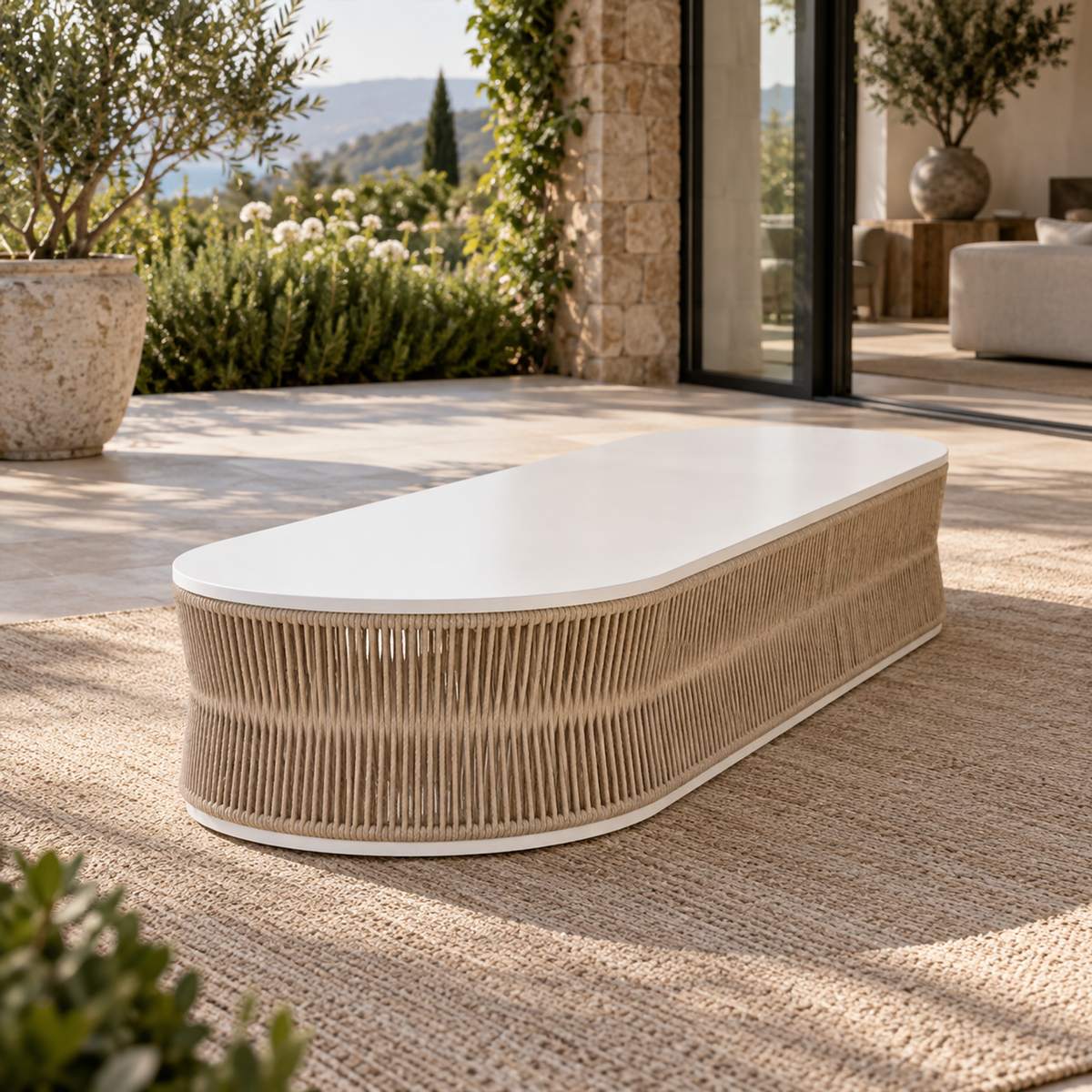 Lifestyle view: Ripple Coffee Table in Aluminium, strong short-end diagonal on a garden home terrace