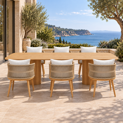 Ripple Outdoor Dining Set in Teak, straight front on a furnished coastal terrace