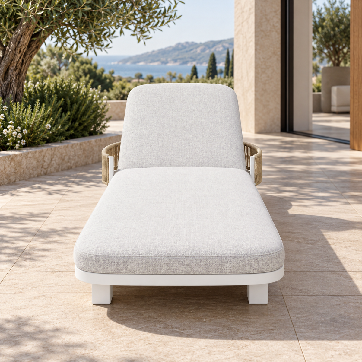 Lifestyle view: Ripple Reclining Sun Lounger in Aluminium, straight foot-end view on a furnished coastal terrace