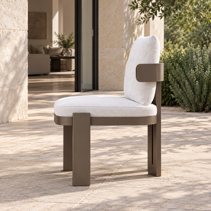 Serein Dining Chair in Aluminium, complete left side view beside a furnished home