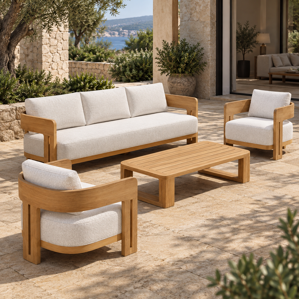 Lifestyle view: Serein teak sofa, two lounge chairs and coffee table, left diagonal on a coastal home terrace